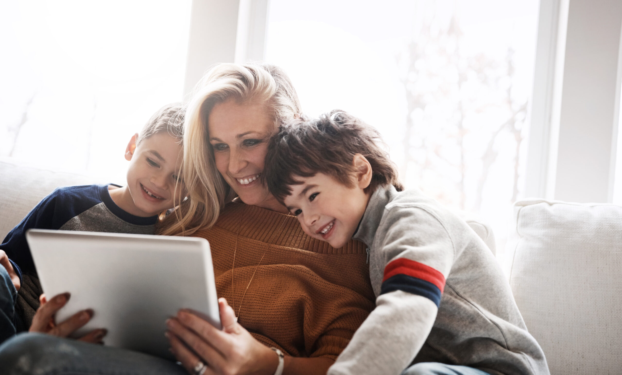 love-brothers-mother-with-tablet-sofa-connection-social-media-funny-videos-bonding-lounge-boys-motherhood-mama-with-device-online-reading-learning-living-room
